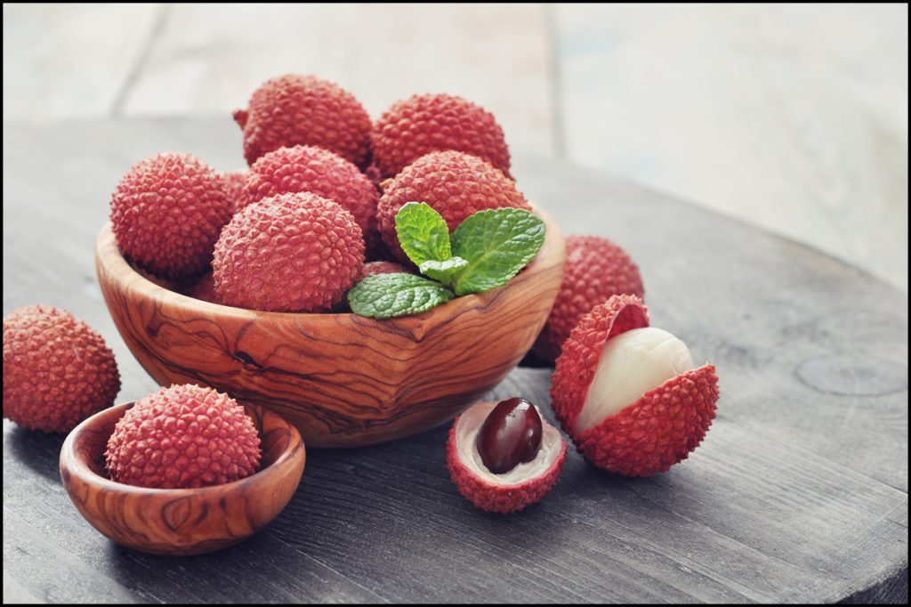 fresh-lychee-in-bowl-on-a-wooden-background